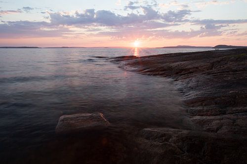 sunset over gentle stone shores scandinavia, karelia
