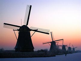 Mill with a lonely skater in Kinderdijk