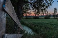 zonsondergang weiland