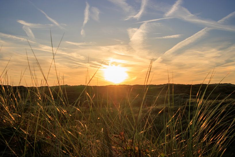 Sunset with an artistic sky by RvK Fotografie