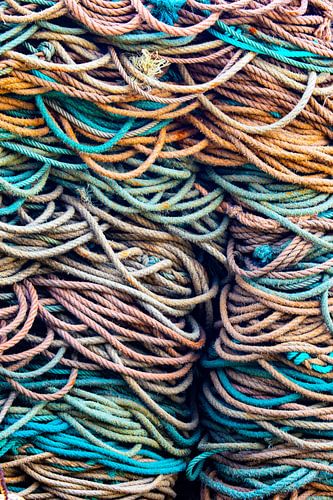 Pile of coloured bunches in harbour.  Wout Cook One2expose