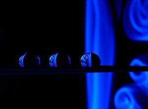 Water droplets with reflection of blue smoke