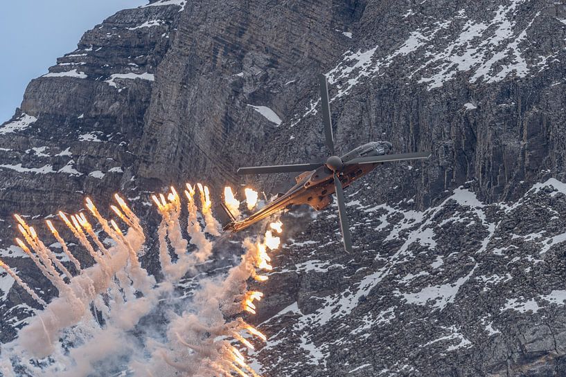 Flares! An AS 532 UL Cougar helicopter of the Swiss Air Force fires a lot of flares during a flight  by Jaap van den Berg
