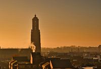 The dawn and a foggy atmosphere with the Martinus Church in Weert