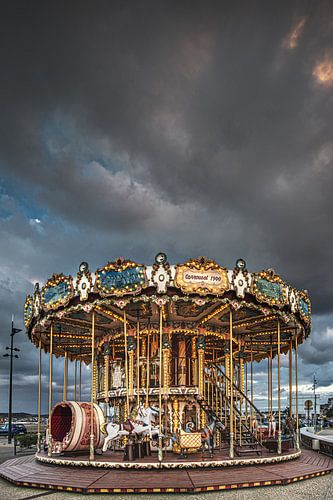 Carousel in evening light with a firm cloudy sky