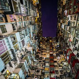 Narrow canyon of houses in Hong Kong by Shanti Hesse