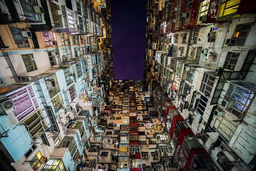 Narrow canyon of houses in Hong Kong by Shanti Hesse