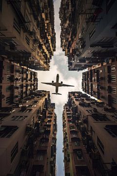 Aeroplane over the cityscape by Poster Art Shop