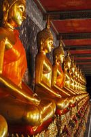 Golden Buddha statues in a Buddhist temple in Bangkok Thailand