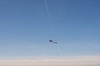 rainbow kite against blue sky