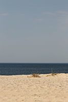 Strand, zon, zee en blauwe lucht