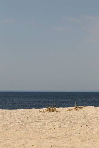 Strand, zon, zee en blauwe lucht