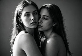 Two women in an intimate black-and-white portrait by Retinas images