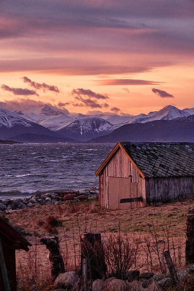 Winter landscape with fishermen's hut and sunset on Godøy, Ålesund, Norway by qtx