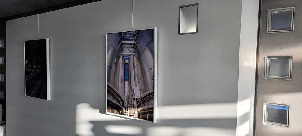 Grey storage tanks  by Martijn Tilroe 