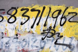 grafitti with numbers on concrete wall by Tony Vingerhoets