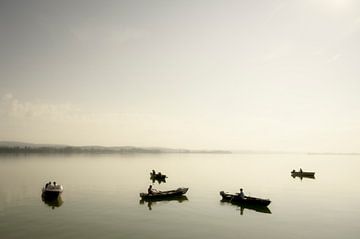 Fishermen in boats on the Untersee during a summer morning by Sjoerd van der Wal