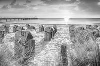 Beach chairs on the beach at the Baltic Sea in black and white.