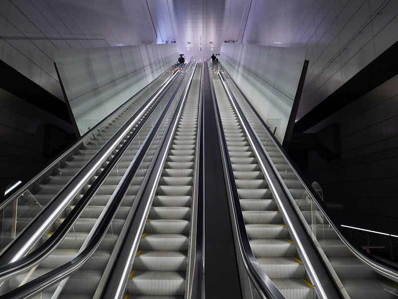 Escalator at a station of line 52 - the North-South line - of the Amsterdam metro. by Gert Bunt