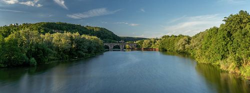 Historic stone bridge over a quiet river