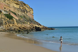 Children playing in Burgau Bay (Praia do Burgau) by Silva Wischeropp
