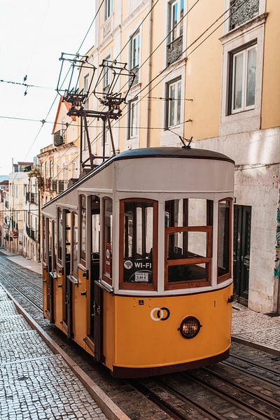 Lisbon yellow tram by Dayenne van Peperstraten
