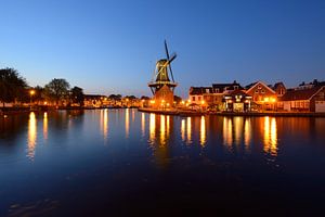 Windmill De Adriaan on the Spaarne in Haarlem in the evening by Merijn van der Vliet