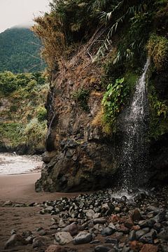 Waterfall on sandy beach Madeira