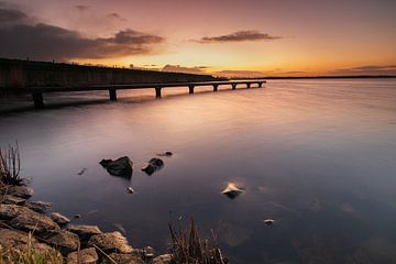 Jetty in the Amstelmeer at a colourful sunrise by Bram Lubbers
