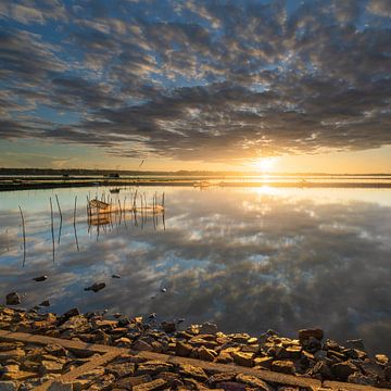 A beautiful sunrise with clouds in Hue, Vietnam by Anges van der Logt