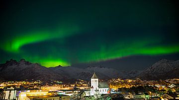 Aurora over the town of Svolvaer on the Lofoten Islands in Norway in winter with snow covered mounta by Robert Ruidl
