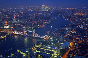 Aerial view of London with the Tower bridge on the River Thames in England at night by Eye on You