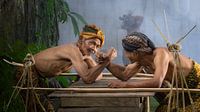 Two Javanese men in an arm fight