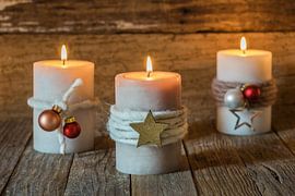 Three burning Candle flames with ornaments and decoration by Alex Winter