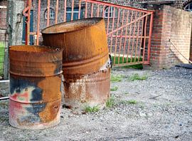Rusty barrels on farm by Atelier Liesjes