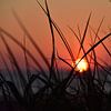 Zonsondergang aan zee van Philipp Klassen