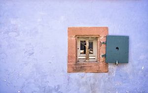 Minimalist photo of an old purple-blue façade with frame in France