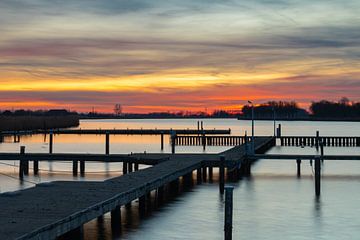 Leaving marina Oude Veer in Anna Paulowna during colourful sunset by Bram Lubbers