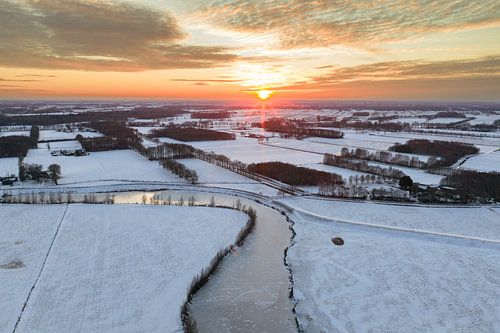 Vecht river flowing through a snowy winter landscape during sunset by Sjoerd van der Wal Photography