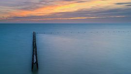 Sunset at a breakwater near Hindeloopen by Henk Meijer Photography