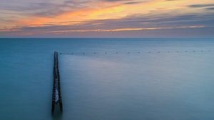Sonnenuntergang an einem Wellenbrecher bei Hindeloopen