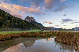 Sunrise with reflection of the mountains