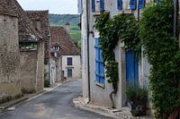 Street in Sancerre, with typical French architecture and blue wooden shutters in front of the windows.