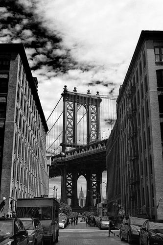 Black-and-white photograph of the Manhattan Bridge and Empire State Building from Brooklyn, New York