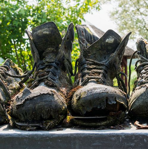 row of old leather worn out shoes 