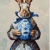 Stilvoller Osterhase mit einem Ei im Delfter Blau-Stil von But First Framing