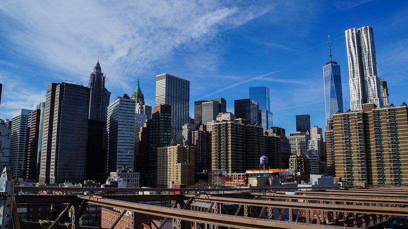 Skyline of Manhattan in New York City from Brooklyn Bridge by adventure-photos