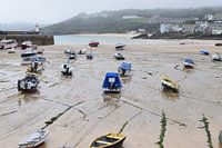 Harbour of English coastal town dried up by the ebb tide