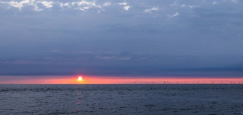 Panoramic image of sun over the sea by Rob IJsselstein