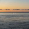 L'immensité de la mer au lever du soleil sur Adriana Mueller